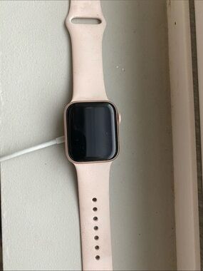Apple Watch with Pink Silicone Band and charger
